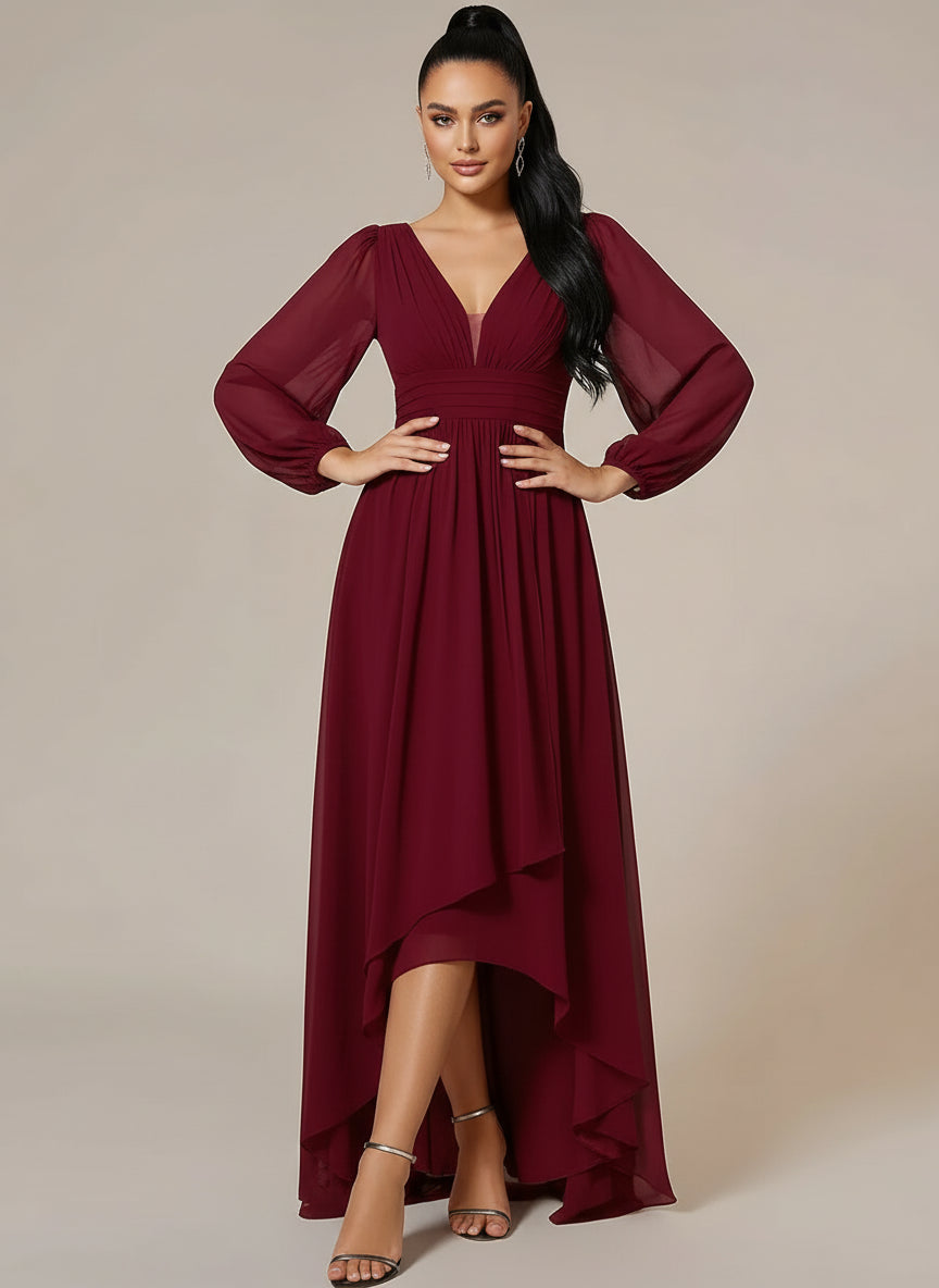 Woman wearing a burgundy dress with long sleeves on a beige background