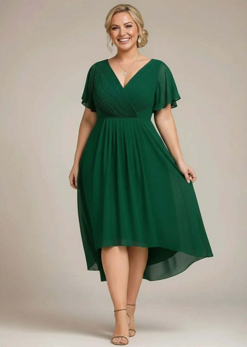 Jerry chiffon mother of the bride or groom dress NZ, front shot of older lady wearing the emerald green coloured dress