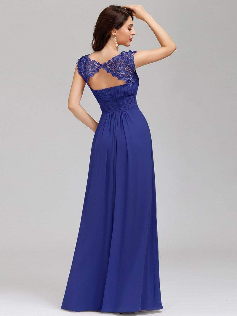 Back pose of woman in elegant sleeve lace and chiffon bridesmaid dress in sapphire