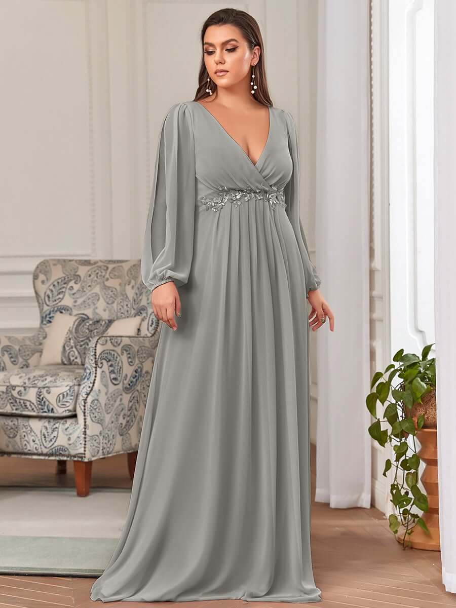 Cindy Evening Formal Ball Dress with Sleeve in Silver Grey. Front side shot of lady wearing.