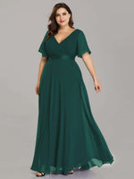 Billie flutter sleeve dress in emerald green Express NZ wide - Bay Bridal and Ball Gowns