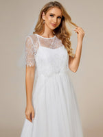 Whisper ivory soft knit and tulle cross back wedding dress and top - Bay Bridal and Ball Gowns