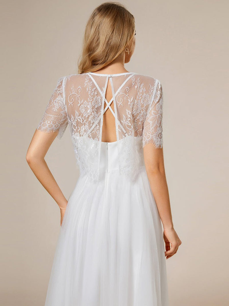 Whisper ivory soft knit and tulle cross back wedding dress and top - Bay Bridal and Ball Gowns